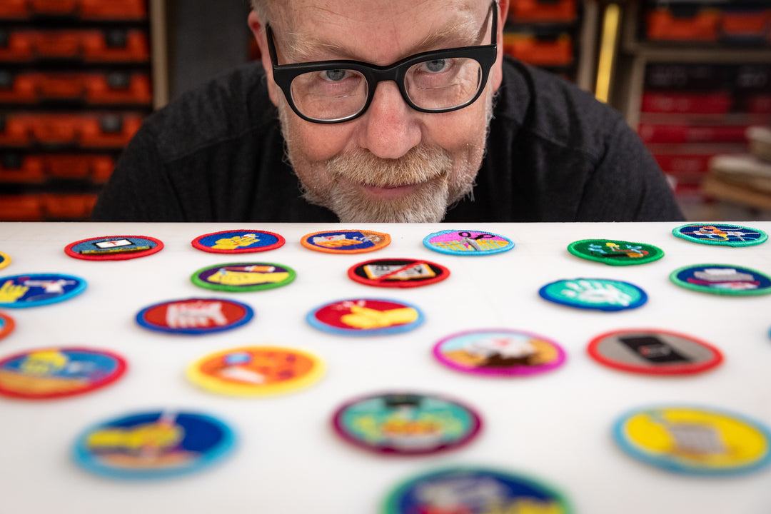Adam Savage looking at Supervisore (de)Merit Badge Bundle