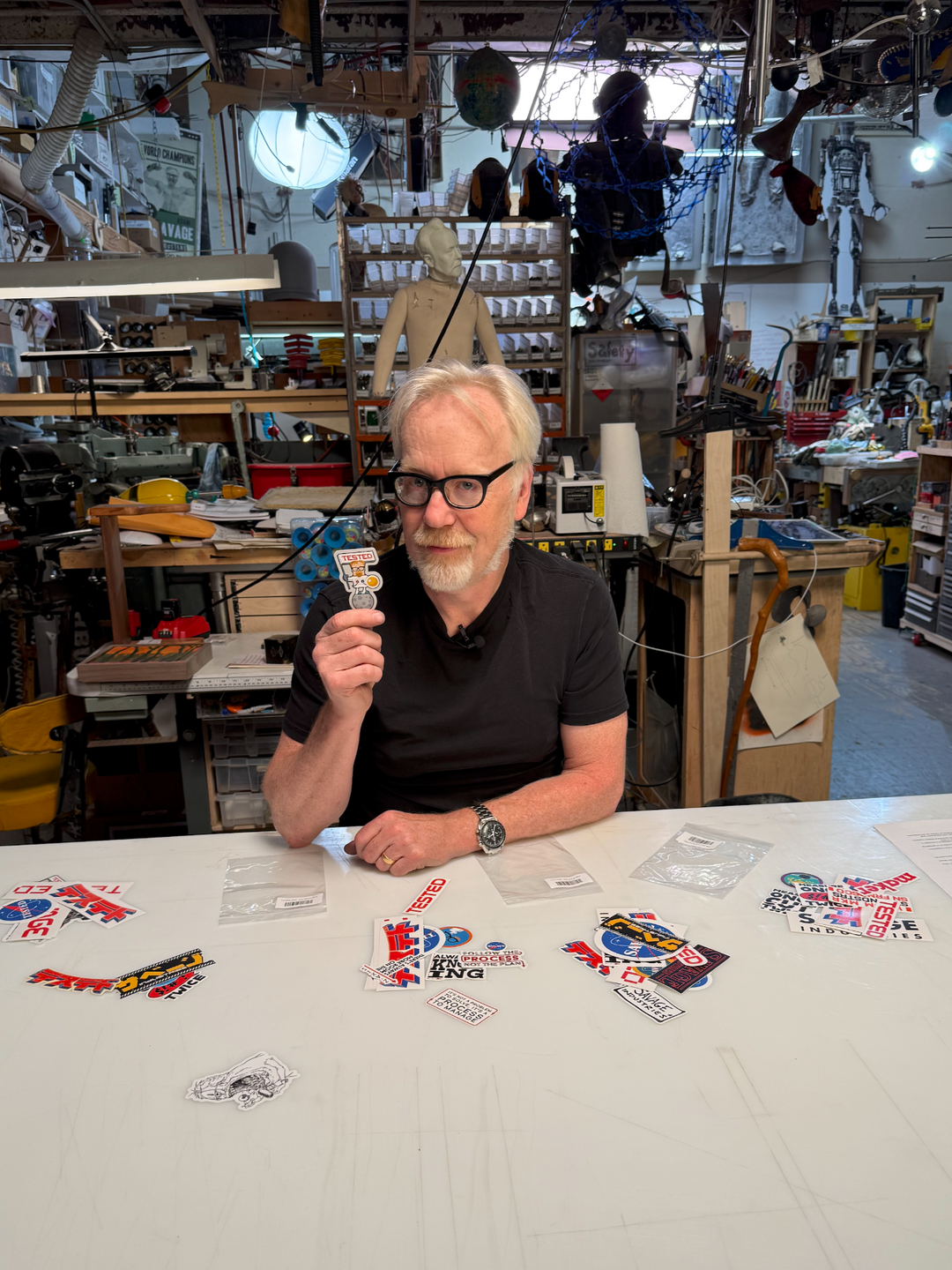 Adam Savage holds 1 of the many stickers included in the Mega Sticker Packs #hero